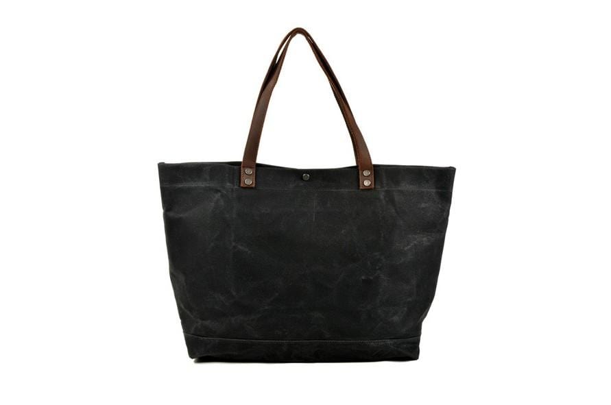 Túi tote đeo vai bằng vải canvas màu đen có nhiều ngăn.