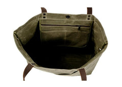 Túi tote đeo vai bằng vải canvas màu đen có nhiều ngăn.