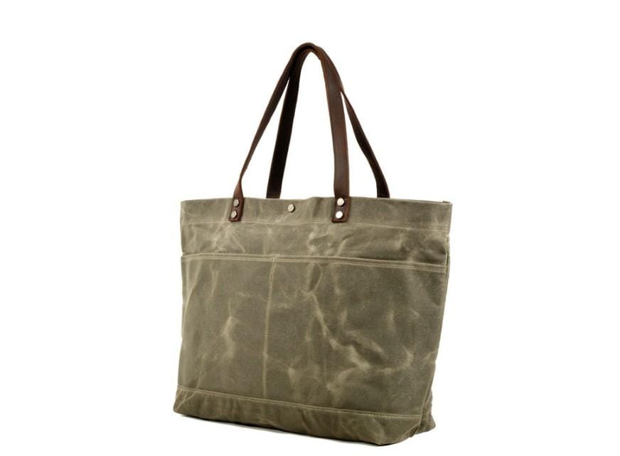 Túi tote đeo vai bằng vải canvas màu đen có nhiều ngăn.